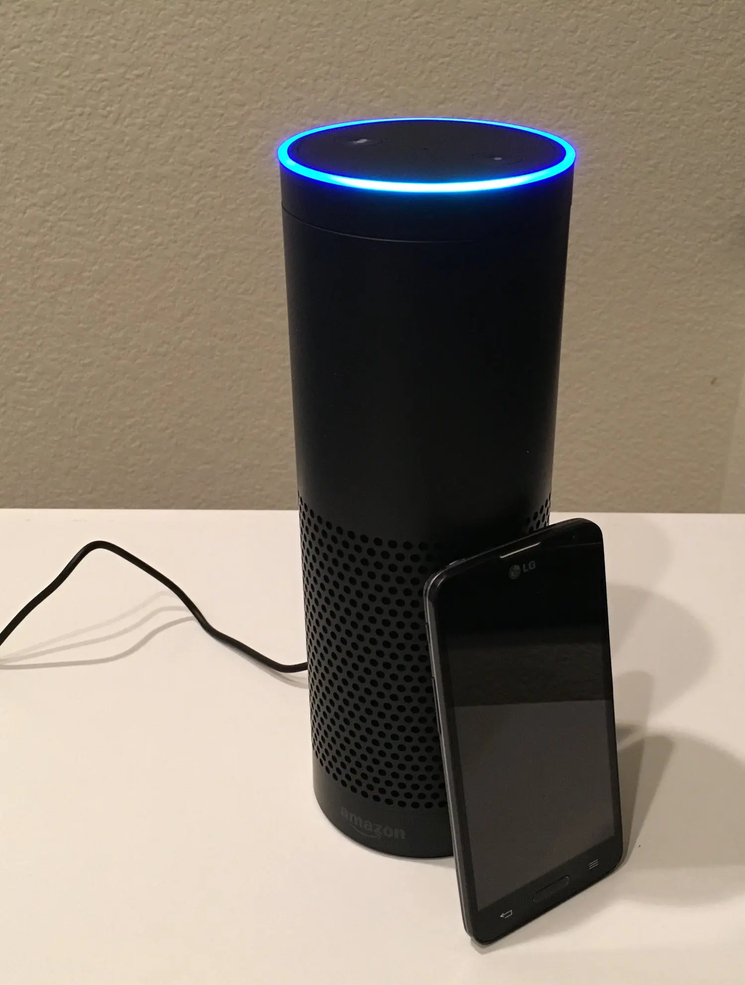 Photo showing the Echo next to a mobile phone